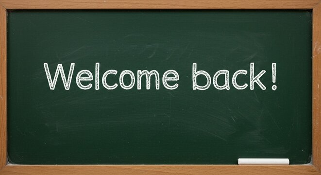 An old-fashioned classroom chalkboard, framed in wood, displays the message "Welcome back!" written in classic white chalk.