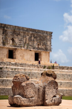 Throne of the two-headed jaguar. In the background is the Palacio del Gobernador or Governor's Palace, in the Ancient Mayan city of Uxmal, a UNESCO World Heritage Site in the Yucatan Peninsula, Mexico