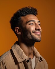 Obraz premium Smiling Young African or Middle Eastern Man in Casual Outfit