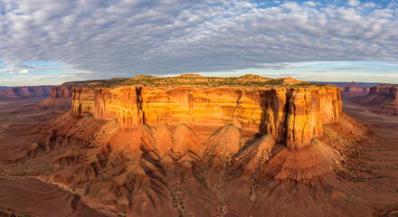 Golden canyon cliffs under a cloudy sky, Breathtaking view of a desert canyon landscape under the morning sky