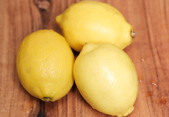 lemons on wooden background