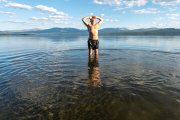 Klocka, Sweden A man bathes in the remote Ånnsjön Lake in the Jämtland region.