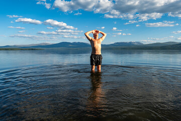 Klocka, Sweden A man bathes in the remote Ånnsjön Lake in the Jämtland region.