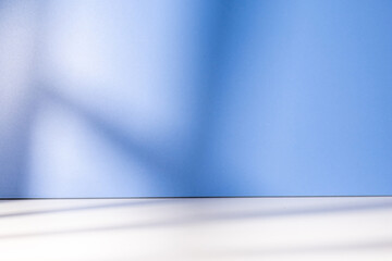 Blue empty room with shadow from window rest on the wall and floor, best for design element background