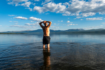 Klocka, Sweden A man bathes in the remote Ånnsjön Lake in the Jämtland region.