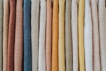 Textile Swatches: A variety of colorful fabric swatches create an eye-catching display, ideal for interior design and creative projects, enhancing texture and warmth.