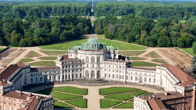 Aerial view of the Palazzina di Caccia, with its architectural grandeur and green dome, surrounded by lush gardens and a vast forest, Stupinigi, Piemonte, Italy.