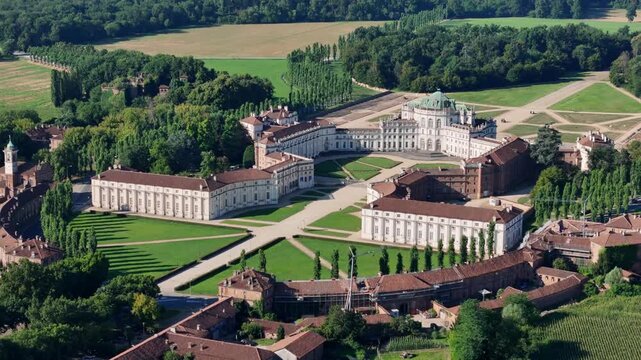 Aerial view of Palazzina di Caccia di Stupinigi and its meticulously designed gardens, a tapestry of green lawns and geometric pathways, Stupinigi, Piemonte, Italy.