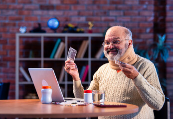 Senior Indian man finds discount on medicine via online shopping at home