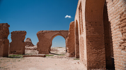 Ruins of historic architecture in Abu Dulaf Iraq under clear blue sky