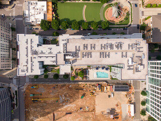 Sunny Daytime Drone Images of TPO Flat Roofs on Commercial and Residential Buildings in Raleigh...