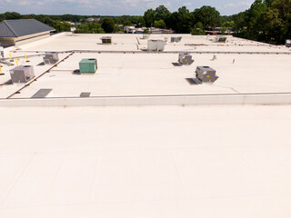 Sunny Daytime Drone Images of TPO Flat Roofs on Commercial and Residential Buildings in Raleigh...