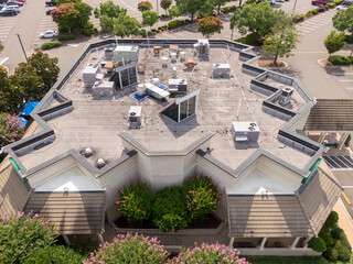 Sunny Daytime Drone Images of TPO Flat Roofs on Commercial and Residential Buildings in Raleigh...