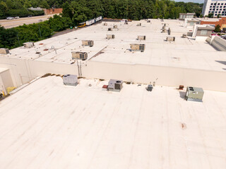 Sunny Daytime Drone Images of TPO Flat Roofs on Commercial and Residential Buildings in Raleigh...