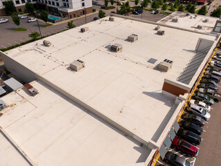 Sunny Daytime Drone Images of TPO Flat Roofs on Commercial and Residential Buildings in Raleigh...