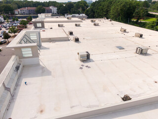 Sunny Daytime Drone Images of TPO Flat Roofs on Commercial and Residential Buildings in Raleigh...