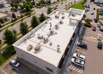 Sunny Daytime Drone Images of TPO Flat Roofs on Commercial and Residential Buildings in Raleigh...