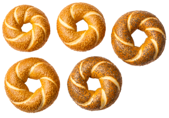 Five Freshly Baked Pretzels Isolated on Black Background