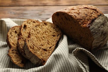 Pieces of fresh bread on table, closeup