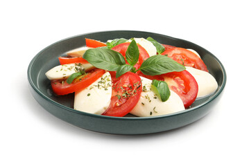 Tasty salad Caprese with mozzarella, tomatoes, basil and spices isolated on white