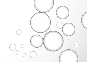 Beautiful clear water bubbles is flying over a grey background. Close up Clear liquid cosmetic product.