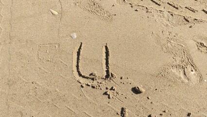 Letter U on The Sand