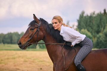 Equestrian Woman Riding Bareback in the Field 