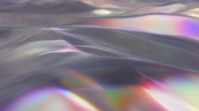 Smooth shimmering prism surface animation with soft waves and rainbow reflections for luxury motion graphics and abstract overlays