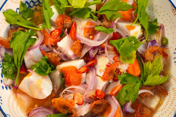 The food that Thai people like to eat is salted egg salad.