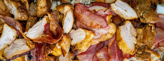 Salad with chicken meat, cherry tomato, onion and chicken meat, marinated cucumbers, mozzarella cheese on background. Horizontal banner