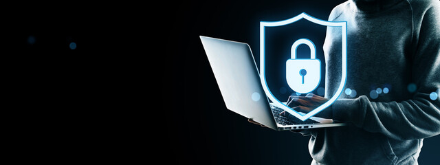 Cybersecurity concept showing user with laptop and glowing padlock shield icon symbolizing secure data, privacy protection, and digital safety.