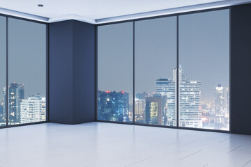 Modern empty office corner interior with large glass windows showing city skyline at night, sleek...