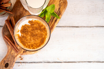 Cinnamon honey milk drink. Dreamy Nighttime Drink, night time warm, relaxing and delicious cinnamon dairy or non-dairy beverage with honey and cinnamon powder, copy space