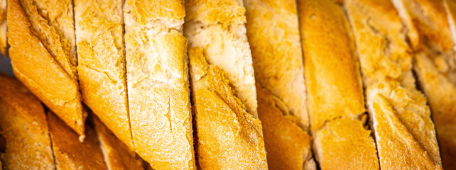 Fresh fragrant breads on the table. Bakery food concept panorama or wide banner photo background
