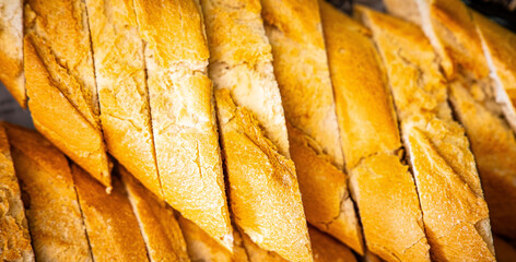 Fresh fragrant breads on the table. Bakery food concept panorama or wide banner photo background
