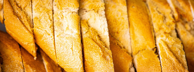 Fresh fragrant breads on the table. Bakery food concept panorama or wide banner photo background