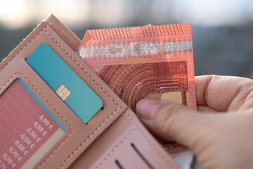 female hands hold money, count paper euro banknotes, Euro bills cash payments, savings, banking,...