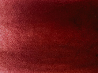 Red velvet fabric texture used as background. Red cloth texture folds. Empty red fabric background.