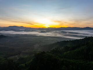 Drone view colorful clouds sunrise sky and fog over mountains.