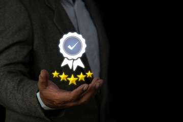 Businessman shows the sign of the top service Quality assurance 5 star, Quality Control or QC and improvement. Standardization and certification concept.
