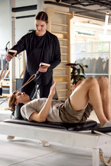 Personal training session with a focus on exercises using equipment for fitness