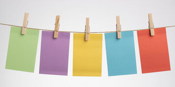 Five Colorful Blank Note Cards Hanging on a Clothesline with Wooden Pegs - Powered by Adobe