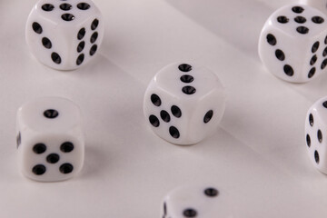 A random arrangement of dice and a puzzle cup, captured after the dice have been cast.