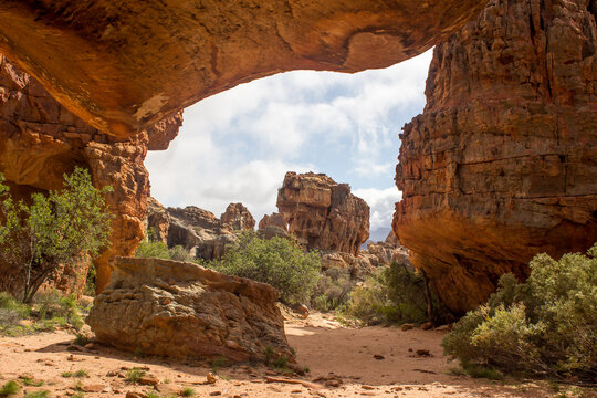 Looking through the strange,  rock formations, forming a natural doorway, at the Stadsaal Caves in the Cederberg Mountains of South Africa