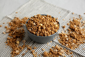 Healthy Homemade Toasted Muesli with Nuts in a Bowl, side view.