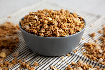 Healthy Homemade Toasted Muesli with Nuts in a Bowl, side view. Close-up.
