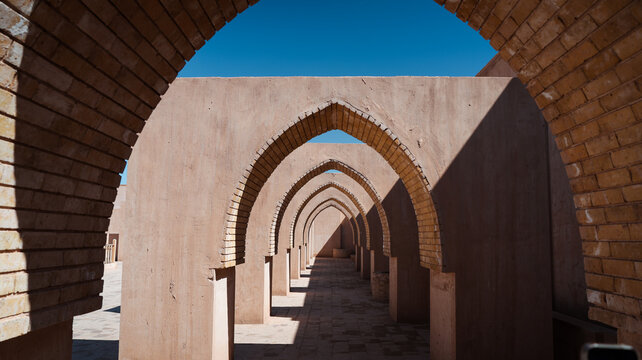 Exploring ancient architecture in Samarra Iraq with stunning arches under clear skies