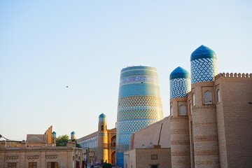 Kalta-minor Minaret and Walled Fortress known as Itchan Kala in Khiva, Uzbekistan -...