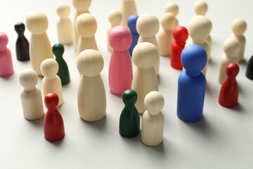 Unemployment. Many different human figures on light background, closeup