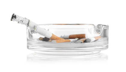 Cigarette butts in ashtray isolated on white